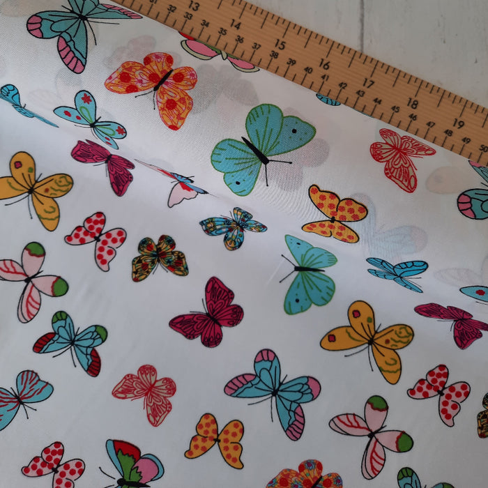 Cotton Poplin Print 112cm - White with Medium Multi colour butterflies Rose & Hubble