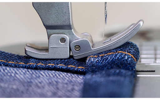 Brother PQ1600S flexible presser foot sewing a layered denim seam