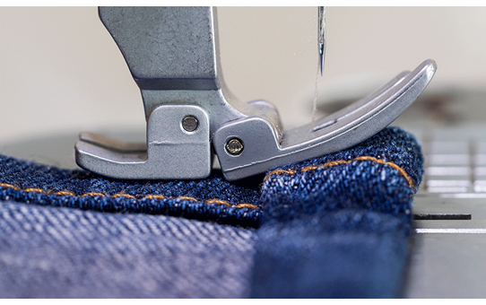 Brother PQ1600S flexible presser foot sewing a layered denim seam