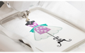 Brother Innov-is F580 embroidering a dress design on white fabric