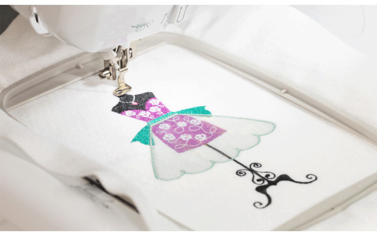 Brother Innov-is F580 embroidering a dress design on white fabric