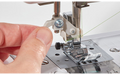 Close-up of needle threader on the Brother SH40 sewing machine