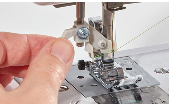 Close-up of needle threader on the Brother SH40 sewing machine