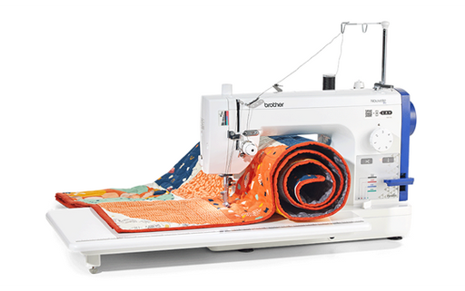 Brother PQ1600S straight stitch machine with wide table and colourful quilt