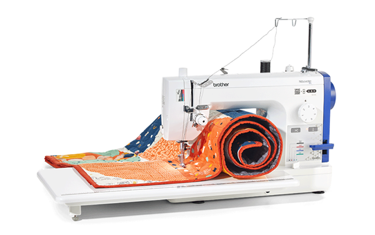 Brother PQ1600S straight stitch machine with wide table and colourful quilt