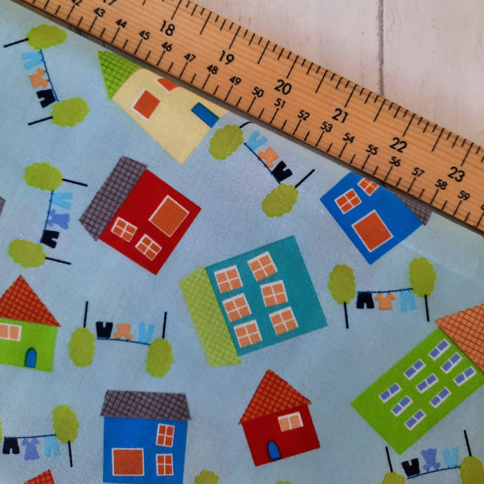 Cotton Poplin Print 112cm - Green/Red/Blue houses on Blue