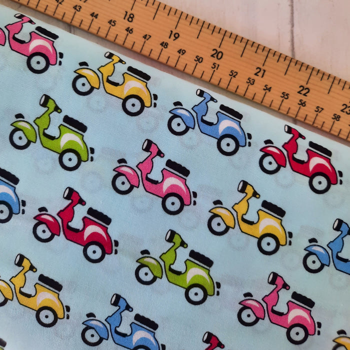 Cotton Poplin Print 112cm - Multi colour Italian Vespa scooters on Blue